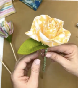adding the leaves to the flower