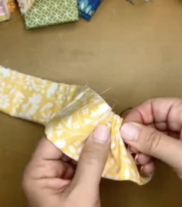 piecing together fabric flowers